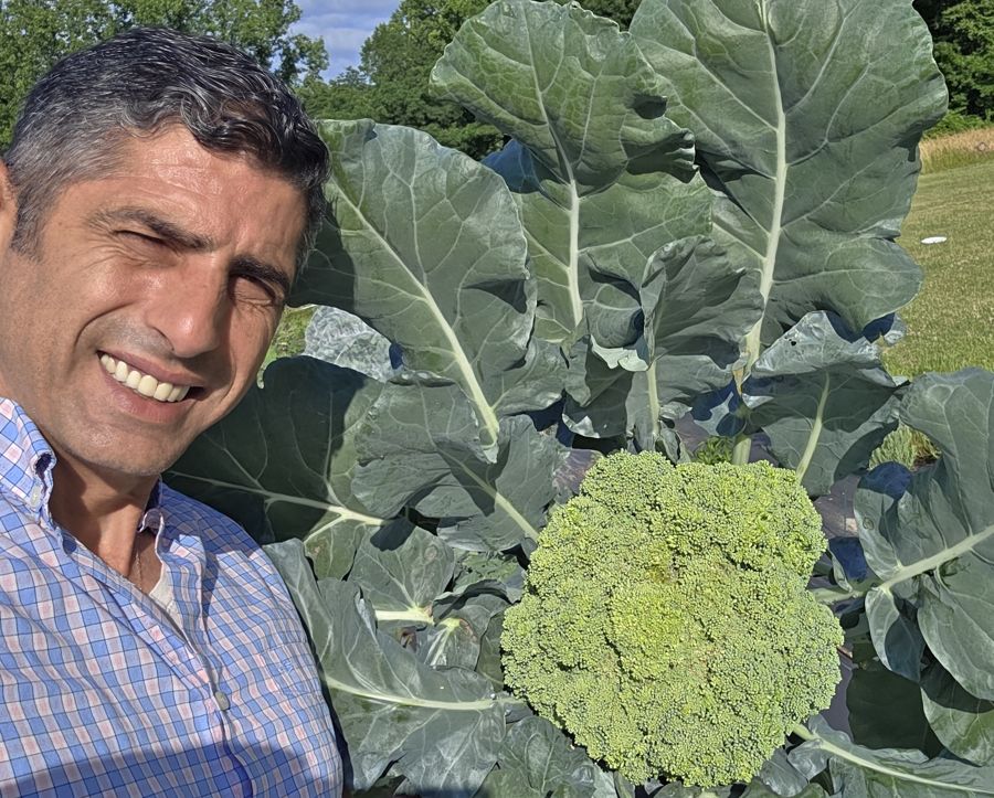 Aviad Giat with a broccoli he grew
